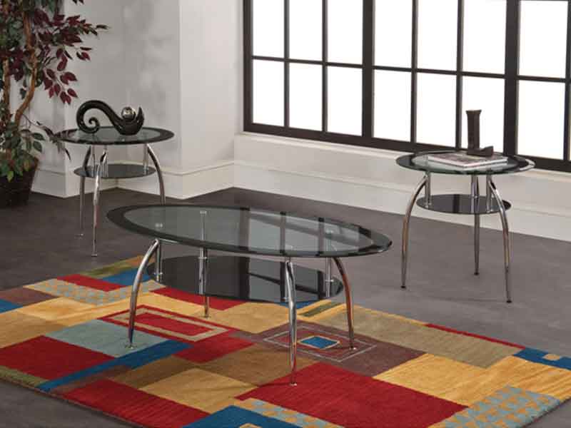Contemporary metal and glass tables with chrome legs. Glass tops have a black painted border and black glass shelf.